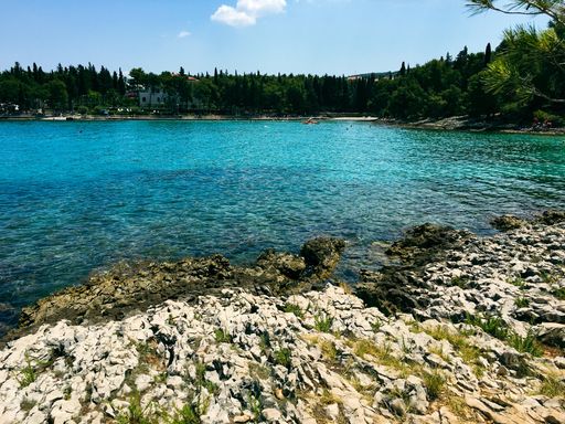 Summer beach view over Brac Island Croatia with views over the water. High Quality Photo.