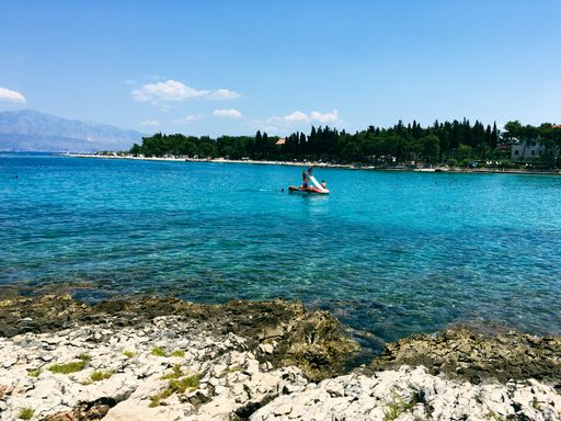 The view over the ocean with people on Brac Island in Croatia