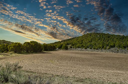 A mesmerizing shot of a beautiful mountainous landscape on a cloudy sky