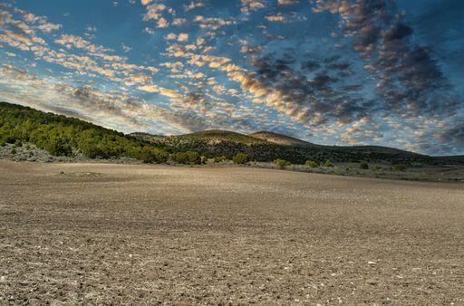 A mesmerizing shot of a beautiful mountainous landscape on a cloudy sky