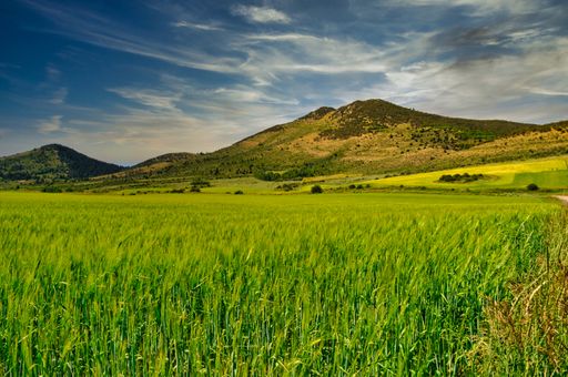 A mesmerizing shot of a beautiful mountainous landscape under a blue sky