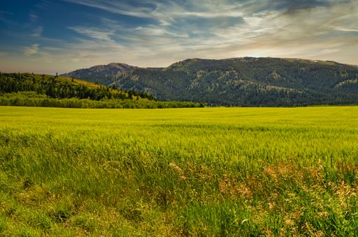 A mesmerizing shot of a beautiful mountainous landscape under a blue sky