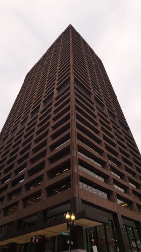 A low angle shot of One Beacon building against cloudy sky in Boston, Massachusetts