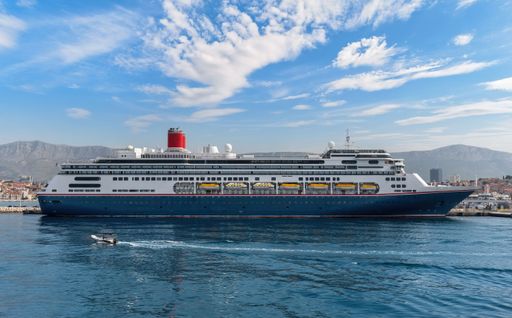 A large and luxurious cruise ship docked in the magnificent waters of the port Split, Croatia