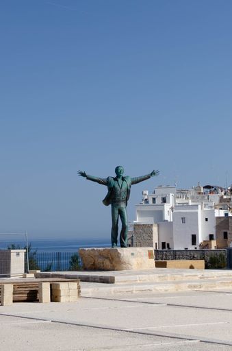 The historic Statue of Italian singer Domenico Modugno on the shore of Mare, Italy