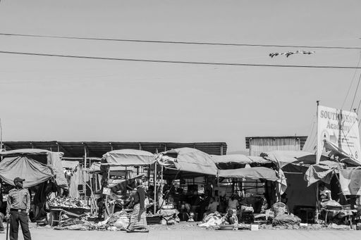 Addis Ababa, Ethiopia, January 30, 2014, Busy street with a row of informal traders selling their goods