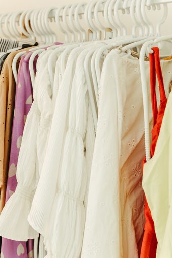 An array of apparel items suspended on a clothing rack