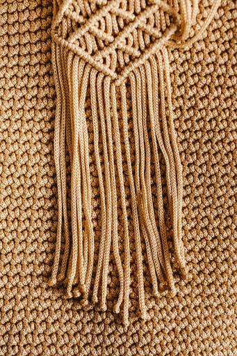 A close-up shot of a handmade crocheted scarf great for a background