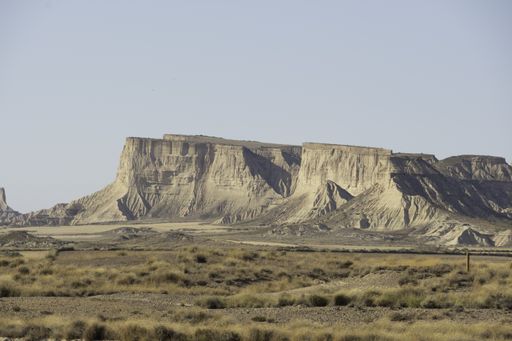 A landscape of Bardenas Reales natural park in Navarra, Spain with an eroded mountain range
