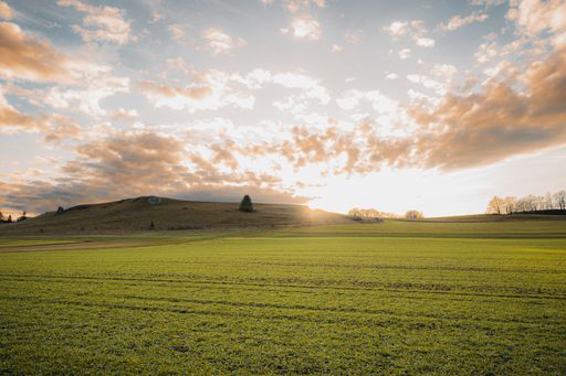 A beautiful shot of a cloudy sunset sky over a rural hill in Baden-Wurttemberg, Germany