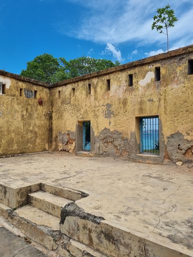 An old destroyed house with blue sky in the background