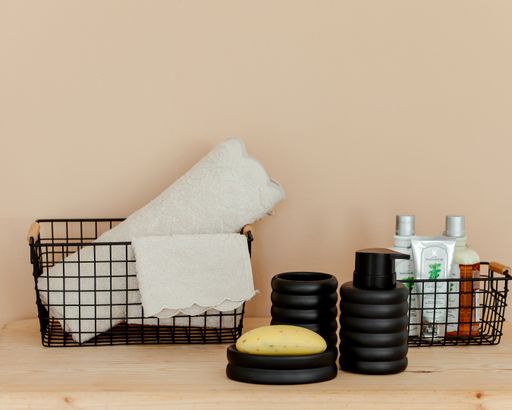 A beautiful shot of bathroom accessories set on brown background