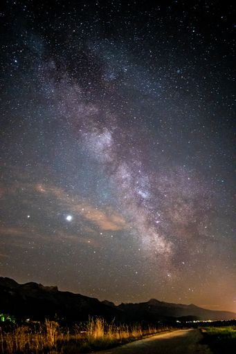 A beautiful view of the Milky Way Galaxy over a landscape