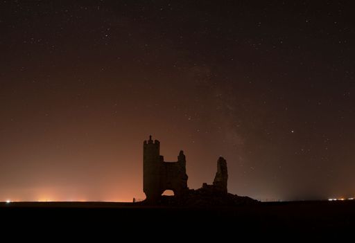 Caudilla castle in ruins in the countryside at night with the Milky Way. Toledo, Castilla La Mancha, Spain