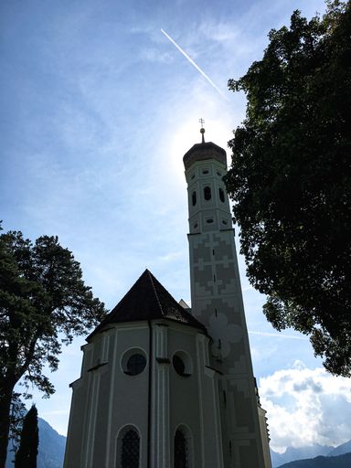 A vertical shot of the St. Coloman church near the Neuschwanstein castle in Bavaria, Germany