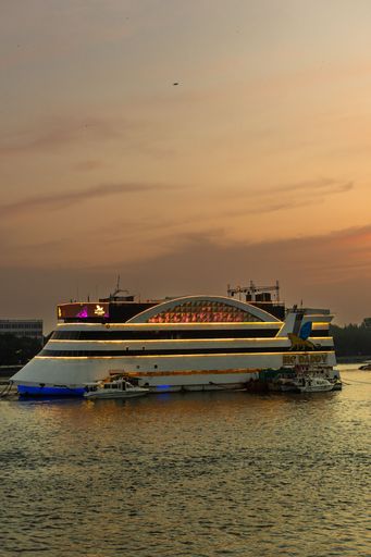 Panaji Goa India Oct 22 2022: Sunset time cruise View of the Atal Setu bridge and activities in the Mandovi river including the river casinos in Goa