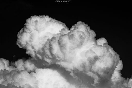 A view of cumulus white clouds isolated on black background