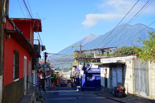 Street view of the village near Antigua Guatemala with volcanos on the backgro