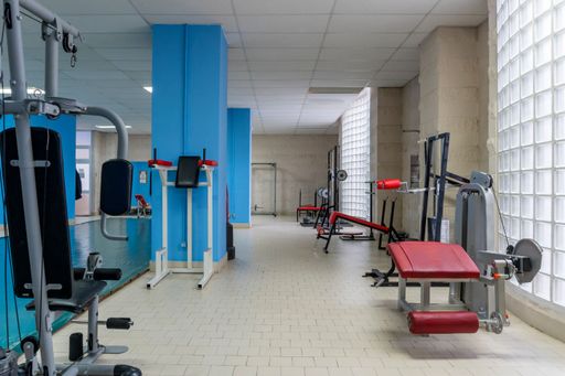 Empty old gym with worn out machines