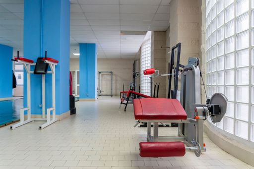 Empty old gym with worn out machines