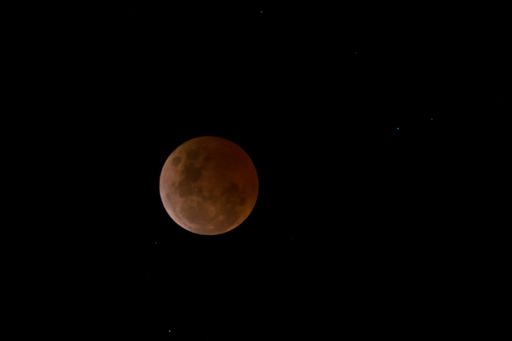 A beautiful view of a Lunar Eclipse full totality on a black background
