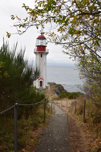 A vertical shot of a pathway to the Sheringham Point Lighthouse