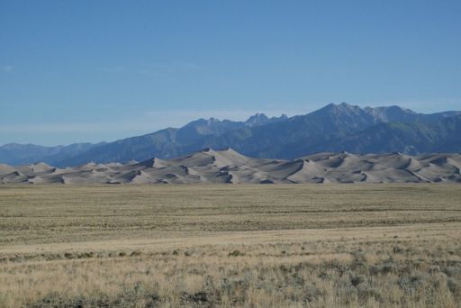 A scenic shot of rocky mountains and sand heights in Great Sand Dunes National Park in Colorado