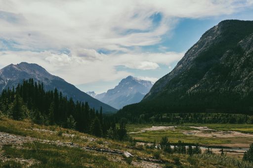 A beautiful landscape with mountains under the cloudy sky