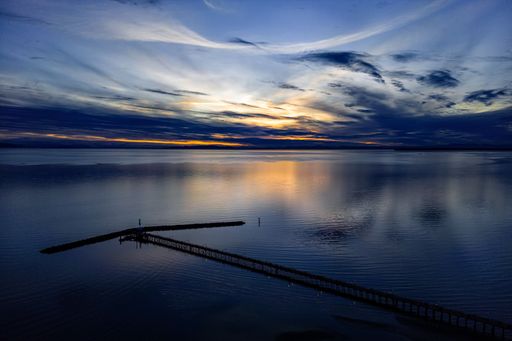 A stunning view of the pier at sunset in White Rock, British Columbia, Canada