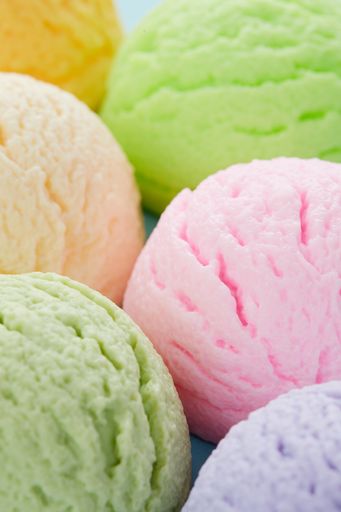 A selective focus shot of various flavored delicious ice cream scoops