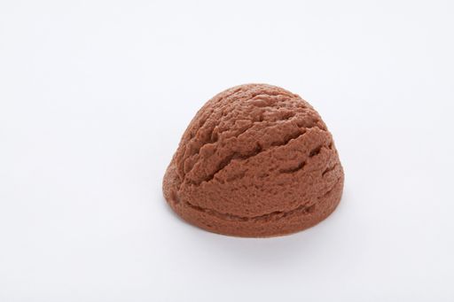 A closeup shot of a delicious chocolate ice cream scoop isolated on a white surface