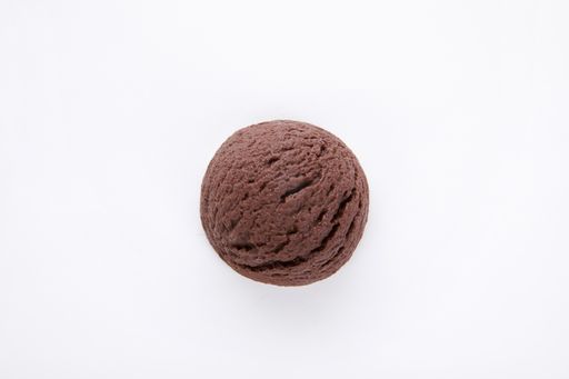 A closeup shot of a delicious chocolate ice cream scoop isolated on a white surface