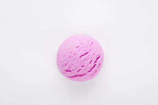 A top view of a delicious blackberry ice cream scoop isolated on a white surface