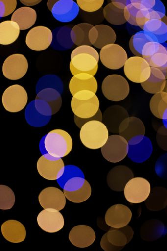 A vertical shot of some light effects on black background