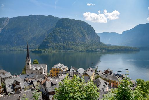A beautiful shot of Hallstatt village in Austria surrounded by greenery-covered mountains