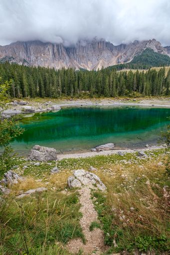 A stunning aerial view of Lake Carezza, located in the Dolomites in South Tyrol, Italy