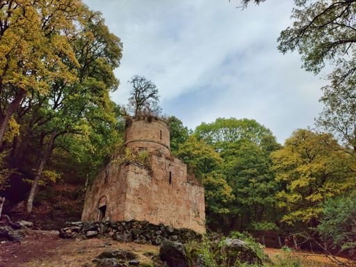 A scenic shot of the Aghavnavank Monastery in Tavush, Armenia under the cloudy sky