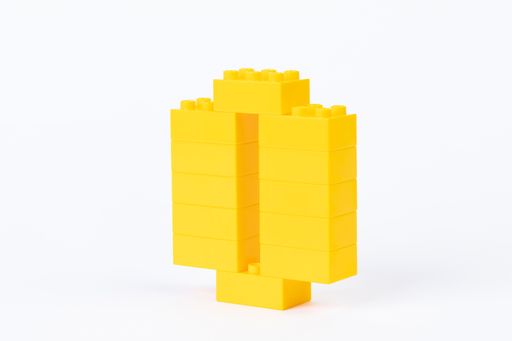 A number 0made of building toy blocks isolated on white background