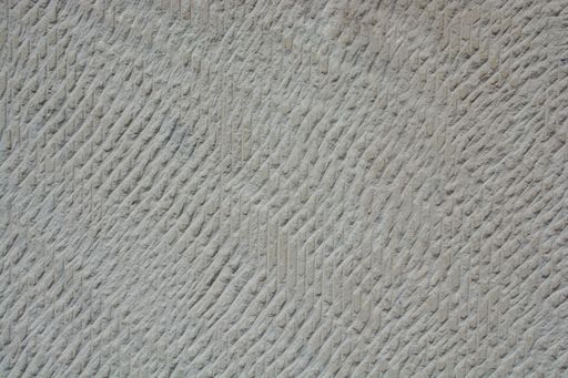 A closeup shot of a stone wall in brown color