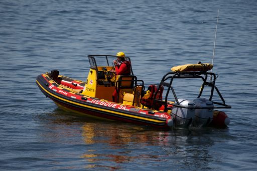 Close-up shot of a National Sea Rescue officer on patrol in Cape Town