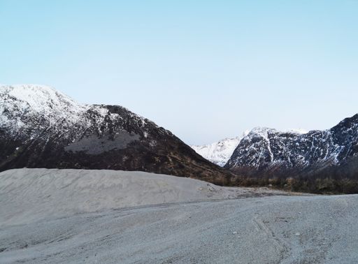 A mountain landscape on the island of Kvaloya in Tromso, Norway under a clear sky background