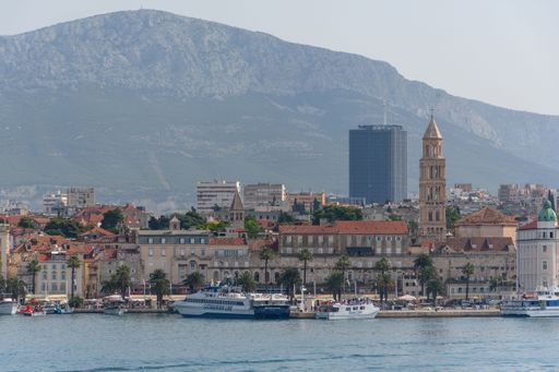 A scenic shot of the city of Split in Croatia before a high mountains on a sunny summer day