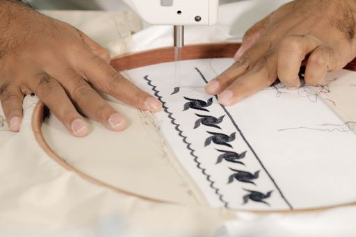 Hand sewing on embroidery machine, embroidery machine
