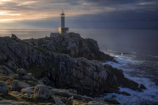 The mesmerizing view of Punta Nariga lighthouse d in Galicia, Spain