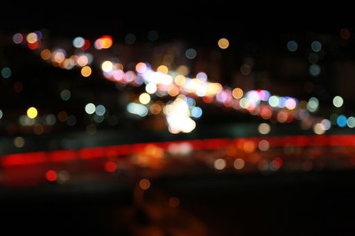 A blurred shot of urban city night light bokeh - great for wallpaper or background