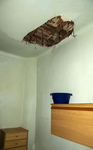 A ceiling of a house damaged by a water leak