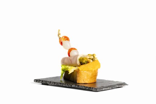 A closeup shot of a delicious sandwich on a black plate isolated on white  background