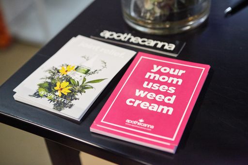 "Your mom uses weed cream" flyers for Apothecanna. Hall of Flowers Cannabis Tradeshow in Santa Rosa, California
