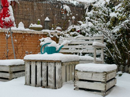 A beautiful shot of garden furniture covered with snow