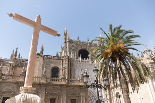 A low angle shot of The Cathedral of Saint Mary or the Seville Cathedral in Spain
